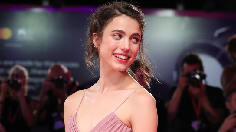 Margaret Qualley glancing back