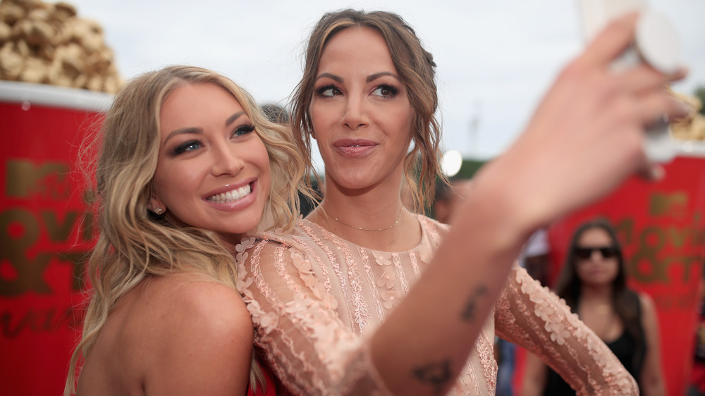 Stassi Schroeder and Kristen Doute taking a selfie on the red carpet 