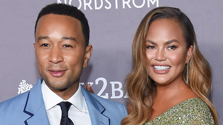 Chrissy Teigen and John Legend posing