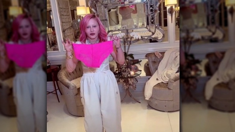 Madonna holding pink underwear