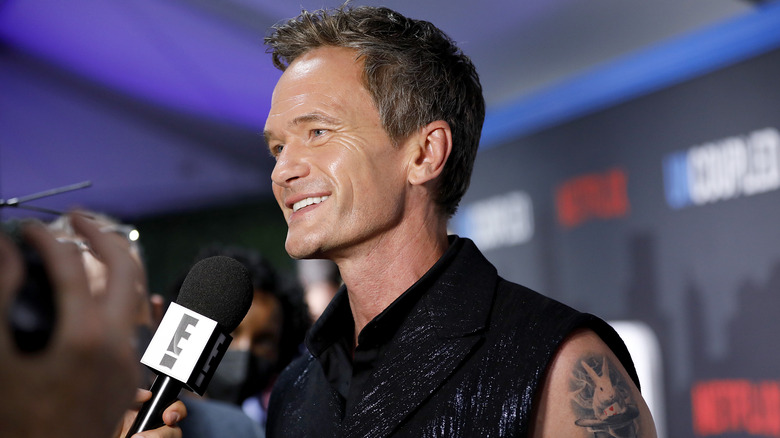 Neil Patrick Harris speaking into microphone