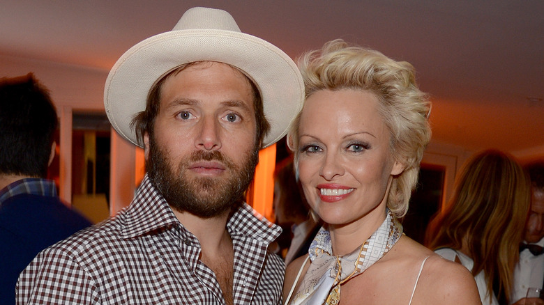 Rick Salomon posing with Pamela Anderson