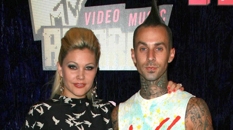 Travis Barker posing with Shanna Moakler