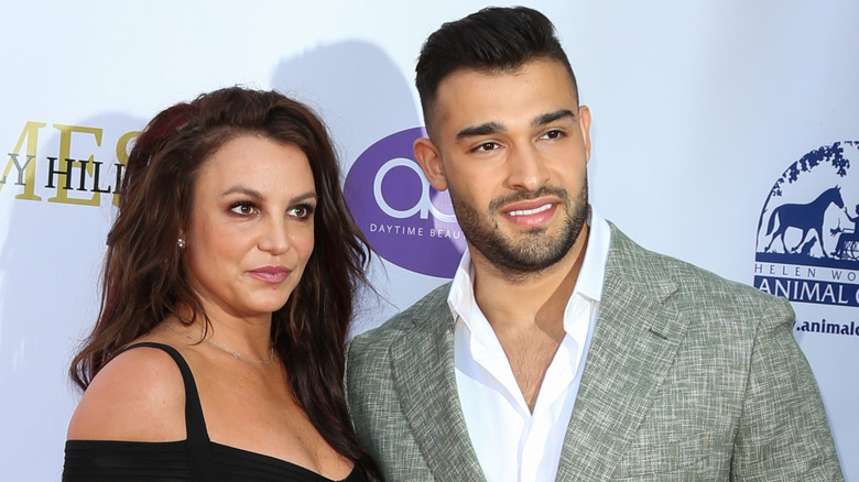 Britney Spears and Sam Asghari, posing at an event