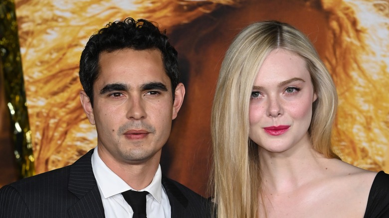 Elle Fanning poses with Max Minghella