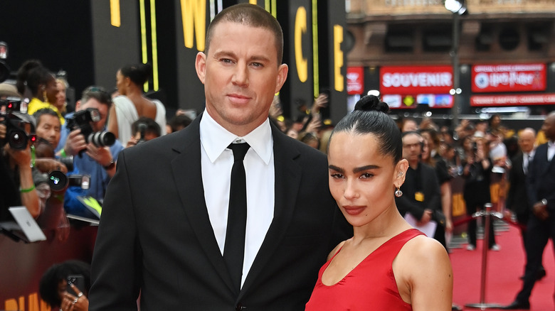 Channing Tatum and Zoe Kravitz on the red carpet with photographers in the background