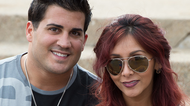 Nicole Polizzi and her husband Jionni LaValle, both smiling