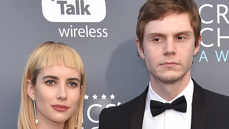 Emma Roberts and Evan Peters, both posing 