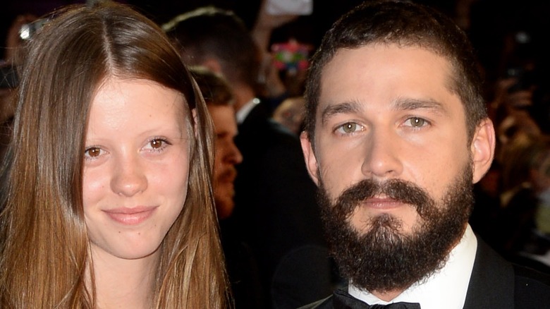 Shia LaBeouf and Mia Goth both smiling