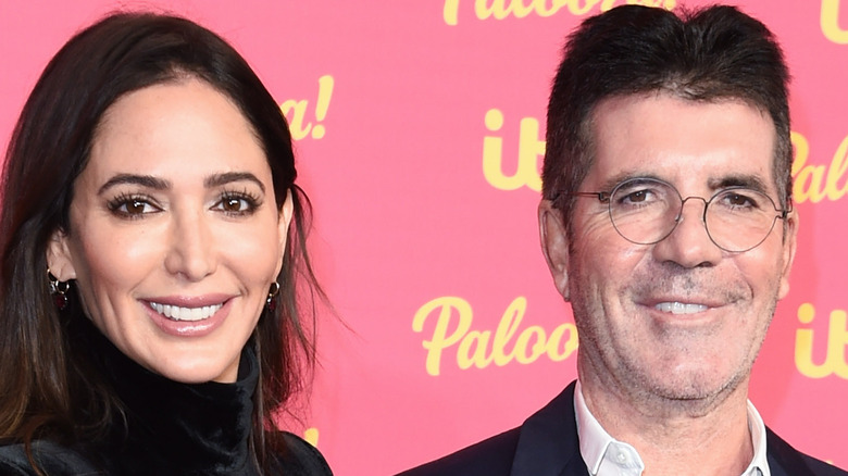 Lauren Silverman and Simon Cowell, both smiling