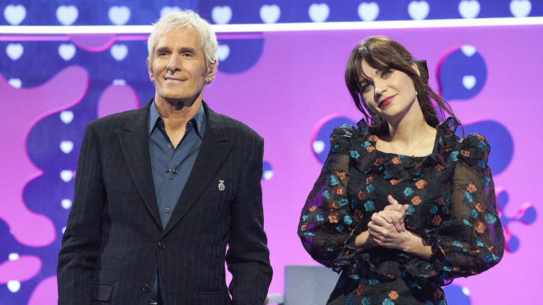 michael bolton zooey deschanel posing on dating game stage