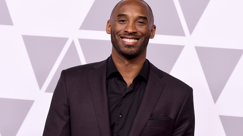 Kobe Bryant posing in suit