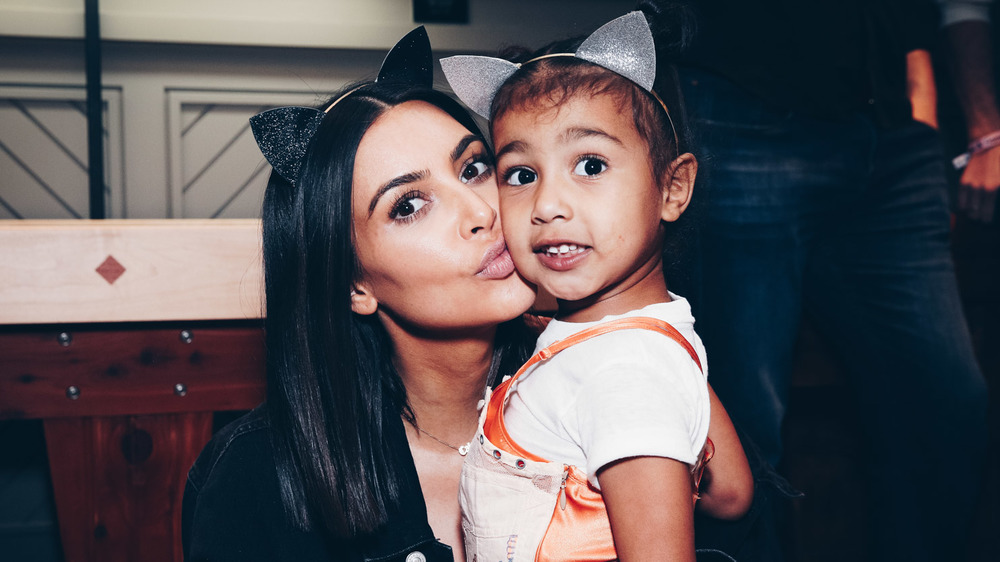 Kim Kardashian kisses North West 