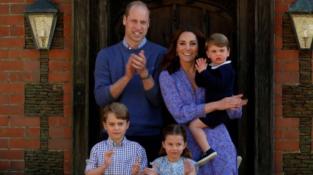 The Cambridges clapping