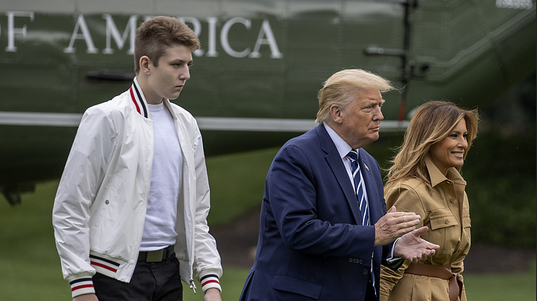 Barron Trump walks alongside parents