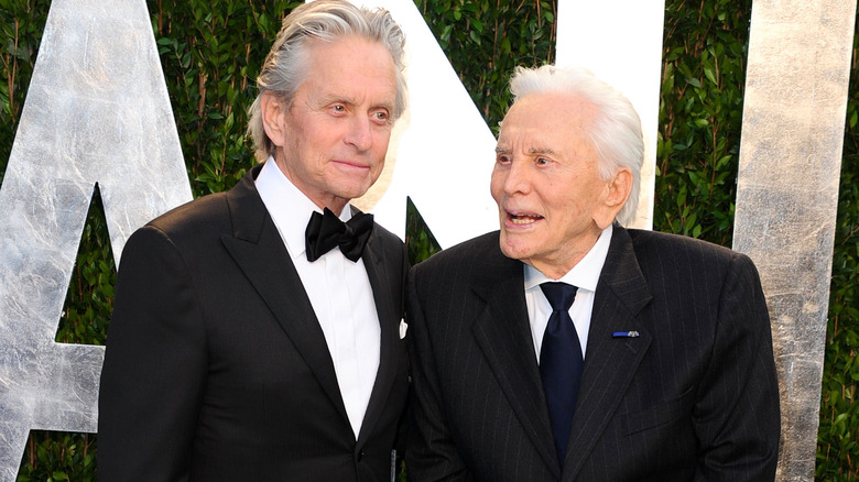 Michael and Kirk Douglas smiling 