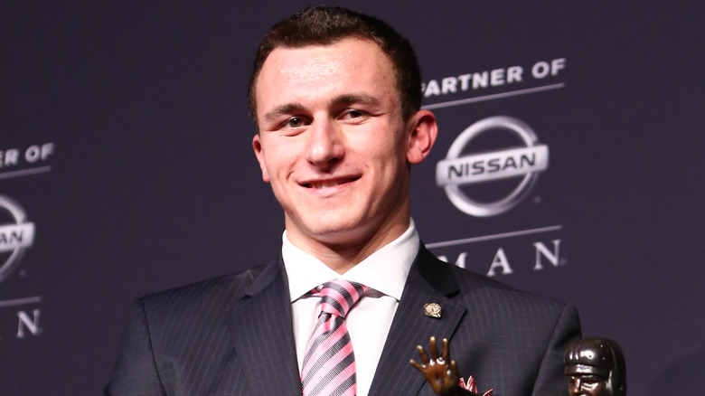 Johnny Manziel smiling with trophy