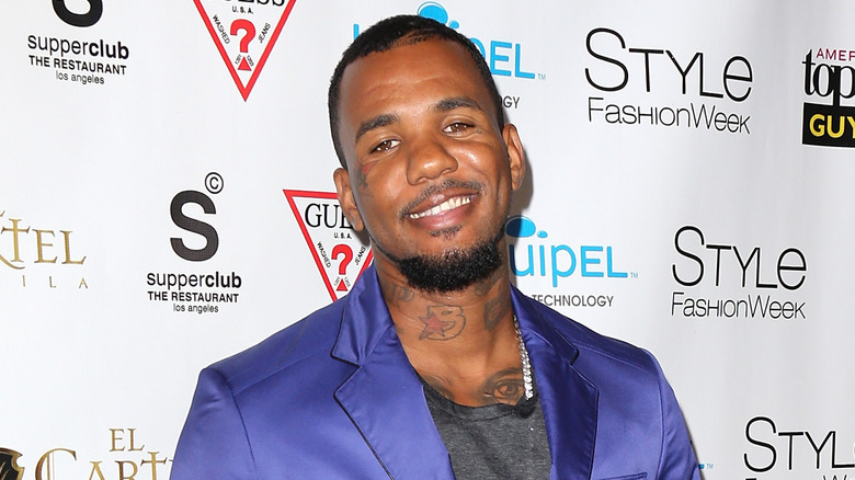 The Game in purple blazer