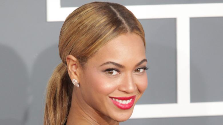 Beyoncé smiling over shoulder