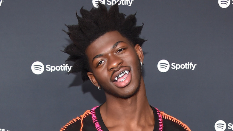 Lil Nas X wearing fangs