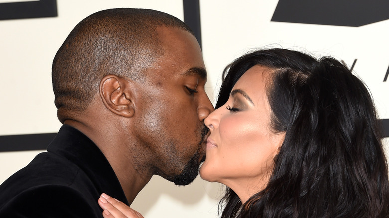 Kanye West and Kim Kardashian kissing