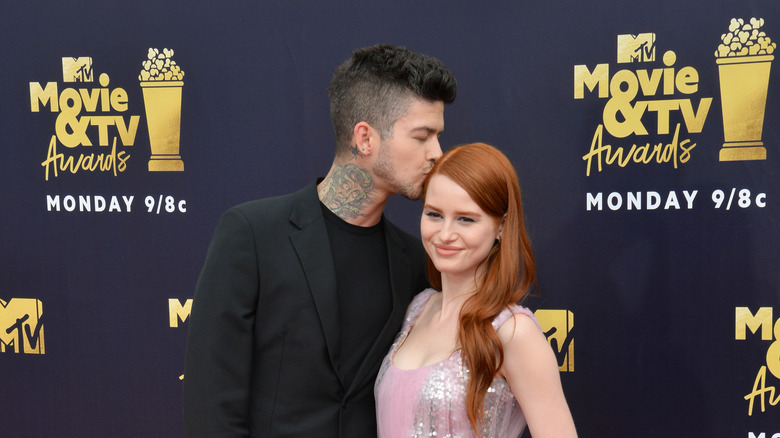 Travis Mills kissing Madelaine Petsch