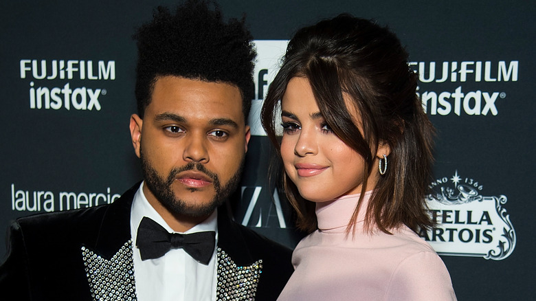 The Weeknd and Selena Gomez posing