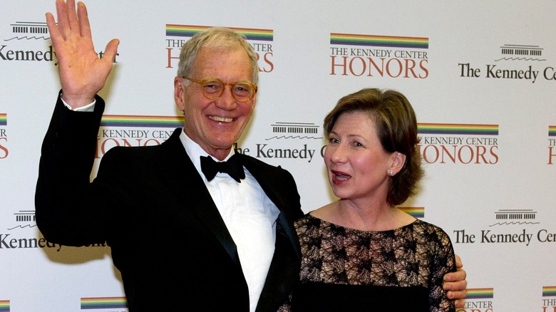 David Letterman poses with wife, waving