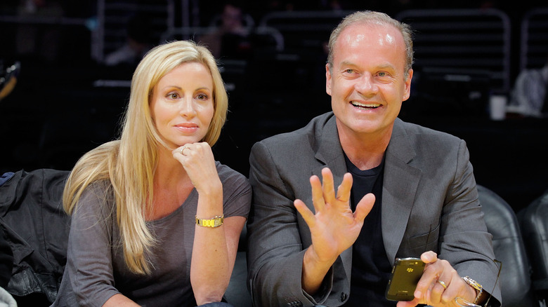 Kelsey Grammer waving beside Camille Grammer