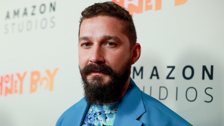 Shia LaBeouf posing in blue suit