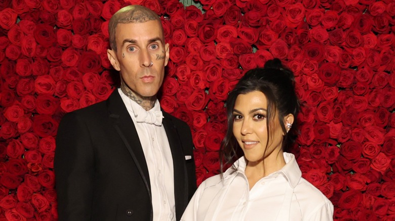 Travis Barker, Kourtney Kardashian posing together