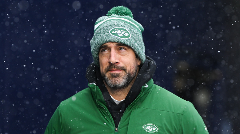 Aaron Rodgers green Jets hat and jacket