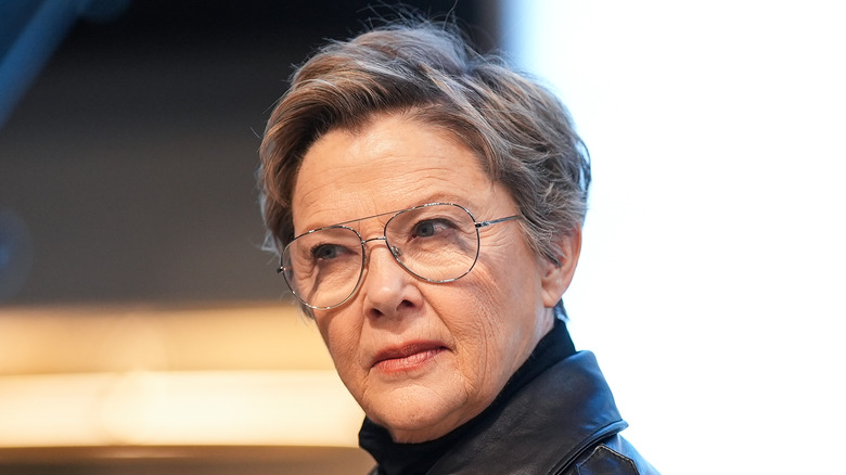 Annette Bening frowning wire glasses