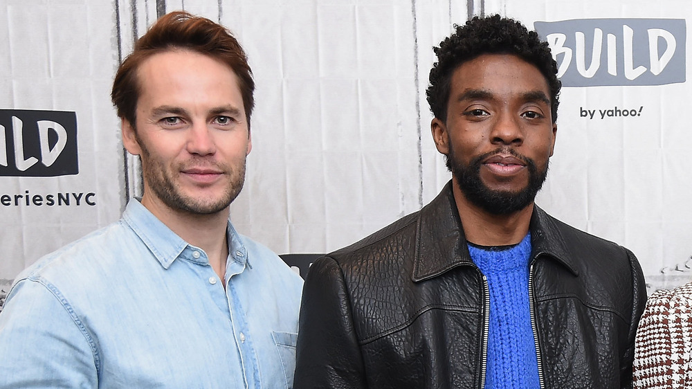 Taylor Kitsch and Chadwick Boseman posing together