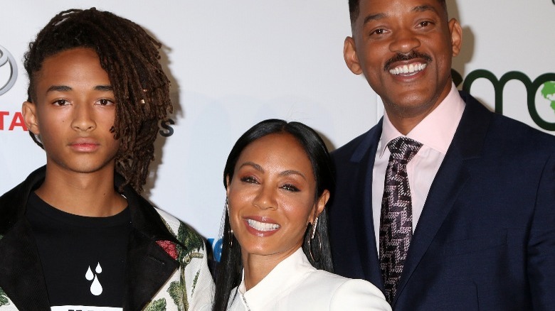 Jaden Smith, Jada Pinkett-Smith, and Will Smith on a red carpet