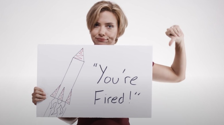 Scarlett Johansson holding sign