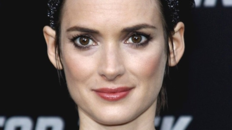 Winona Ryder half smiling