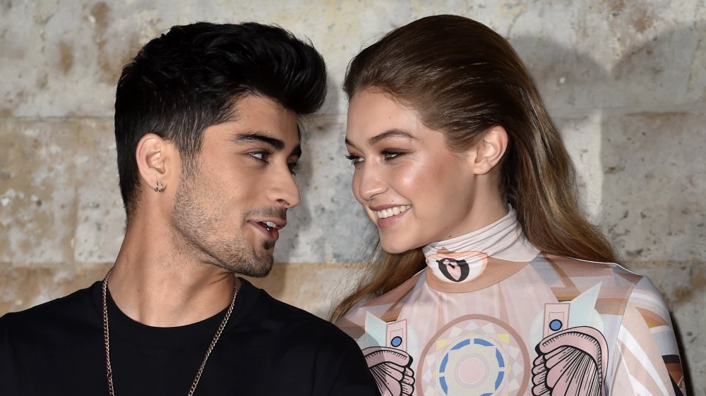 Zayn Malik and Gigi Hadid smiling at each other 