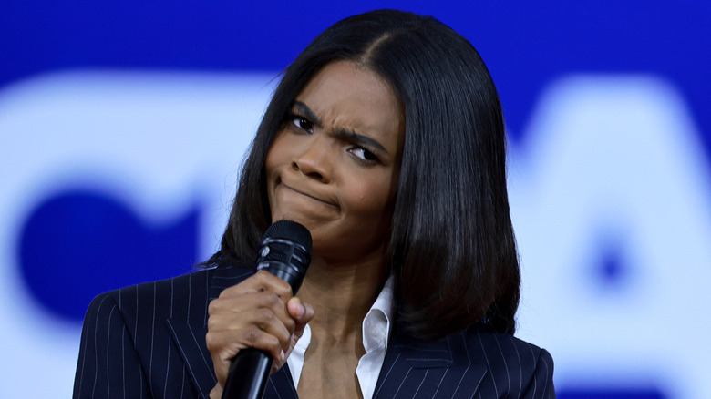 Candace Owens speaks into the microphone while making a doubtful face