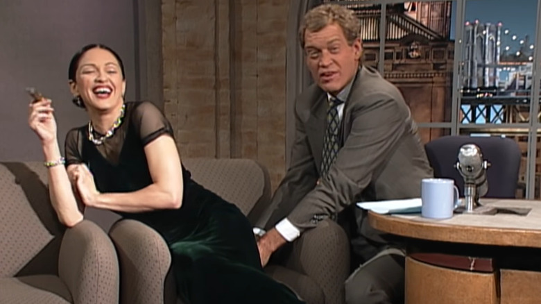 David Letterman reaching underneath Madonna's rear