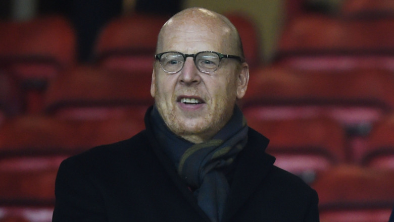 Avram Glazer watching a soccer game