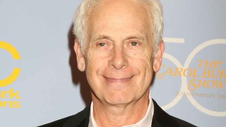 Christopher Guest smiling awkwardly