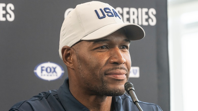 Michael Strahan in baseball cap