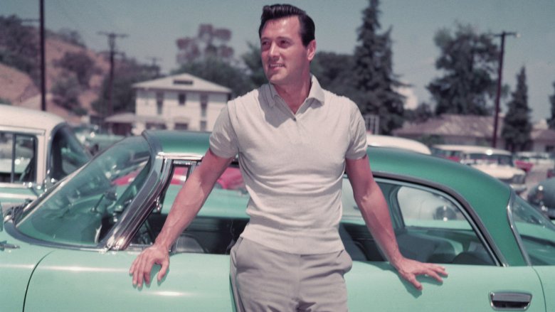 Rock Hudson leaning on car