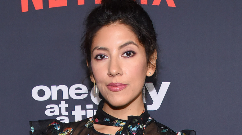 Stephanie Beatriz smirking