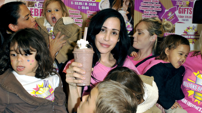 Nadya Suleman holding milkshake with kids