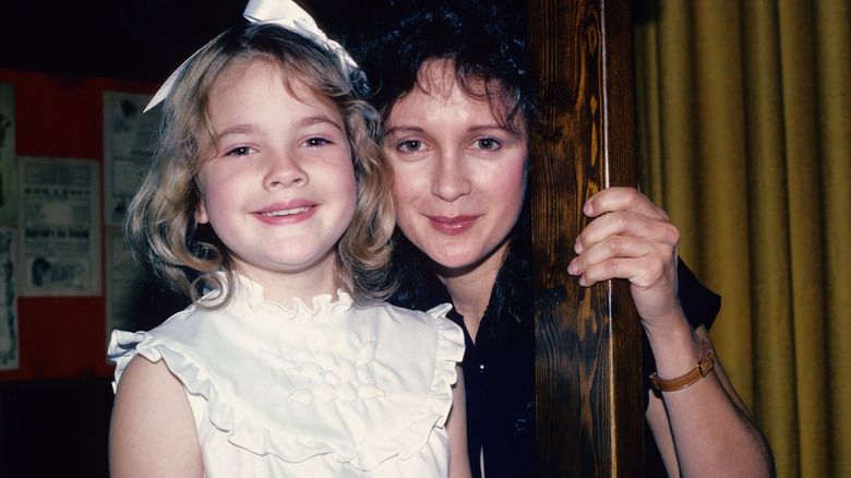 Young Drew Barrymore posing with Jaid Barrymore