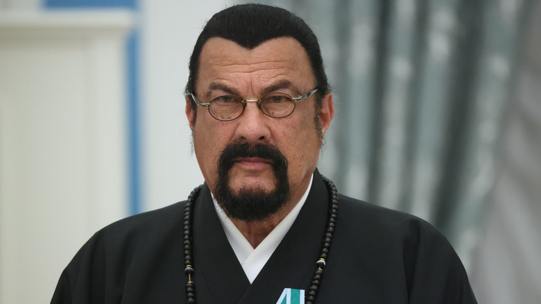 Steven Seagal wearing a black robe