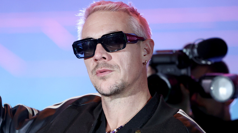 Diplo performing with sunglasses on