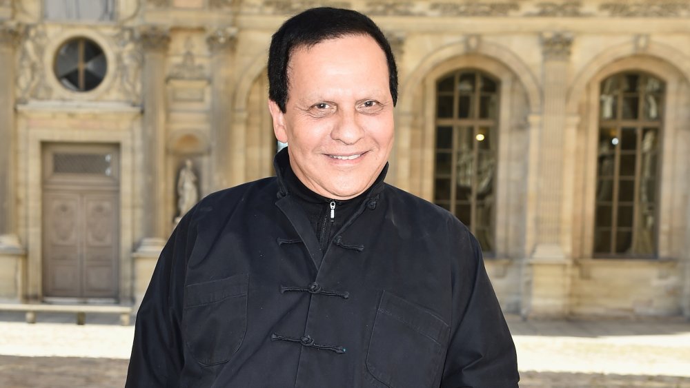 Azzedine Alaïa posing outside